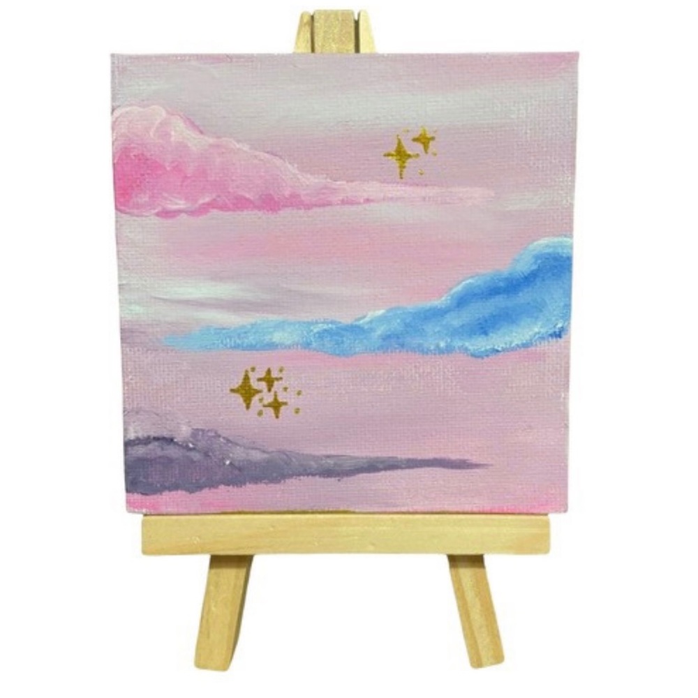 Mini hand painted “ dreamy clouds” on a 4x4 canvas. Comes with an easel.